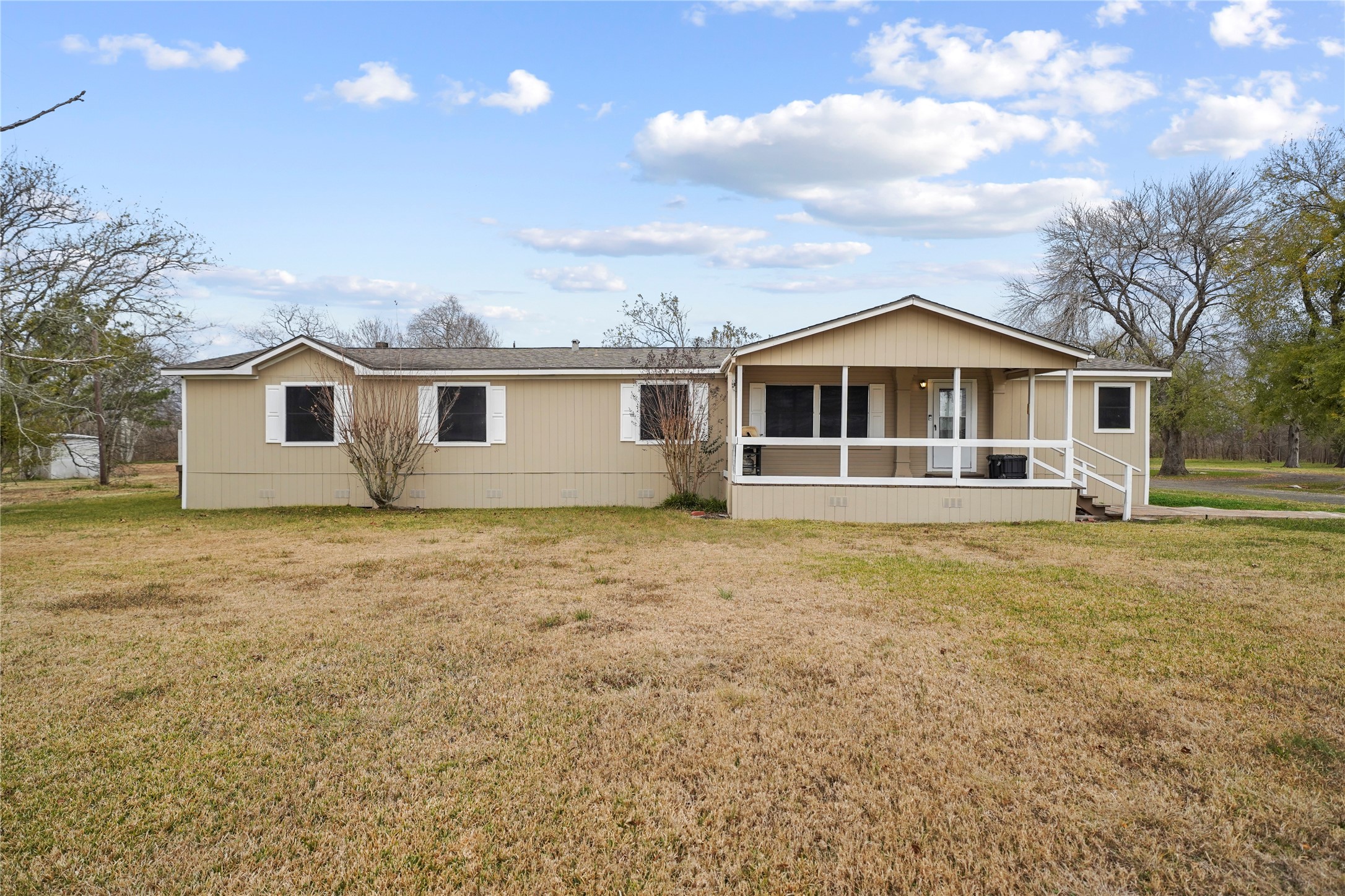19645 Nordt Road Damon, TX 77430 - Photo 3 of 50 a view of a house with a backyard