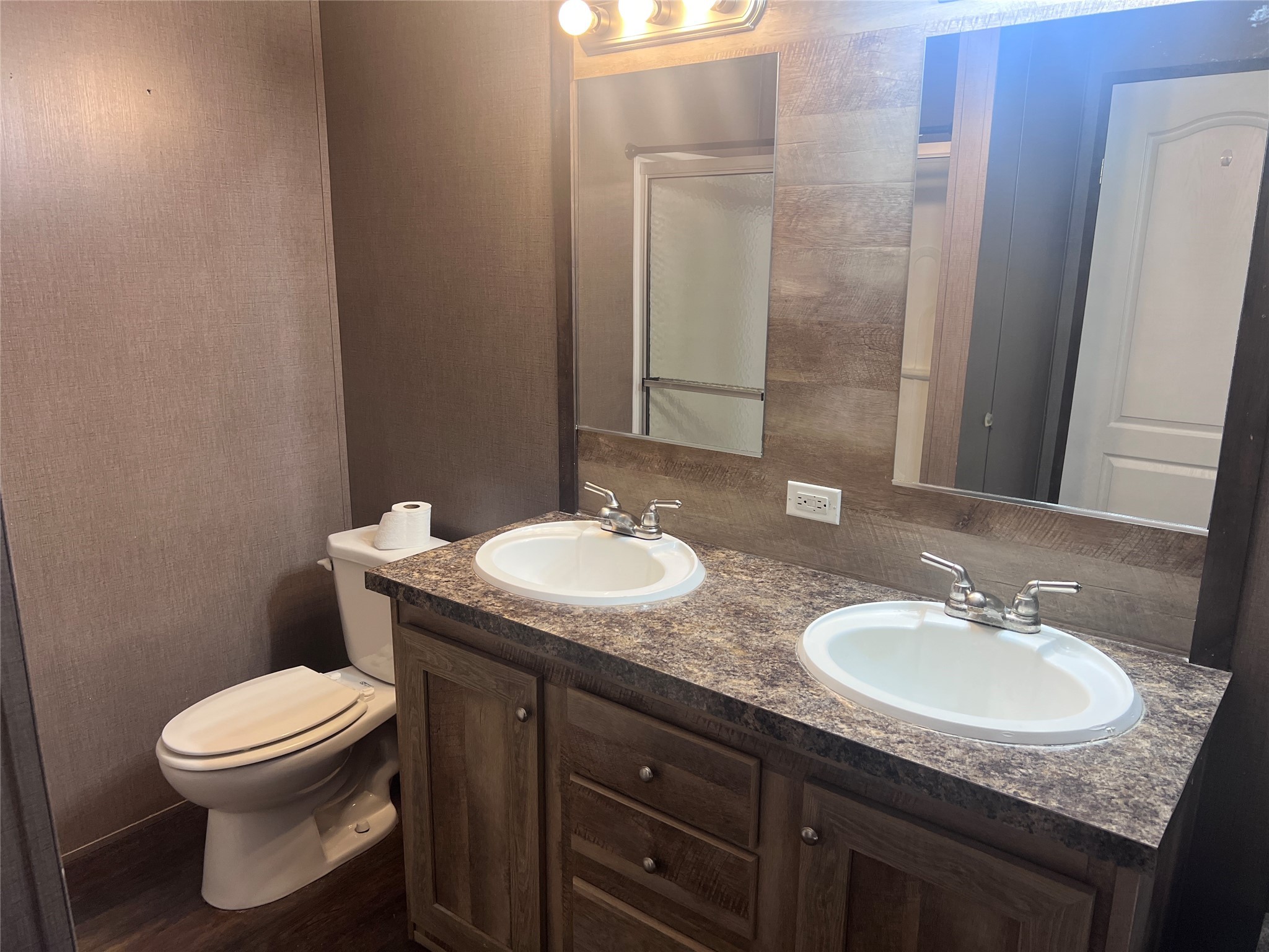 19645 Nordt Road Damon, TX 77430 - Photo 43 of 50 a bathroom with a granite countertop sink and a mirror
