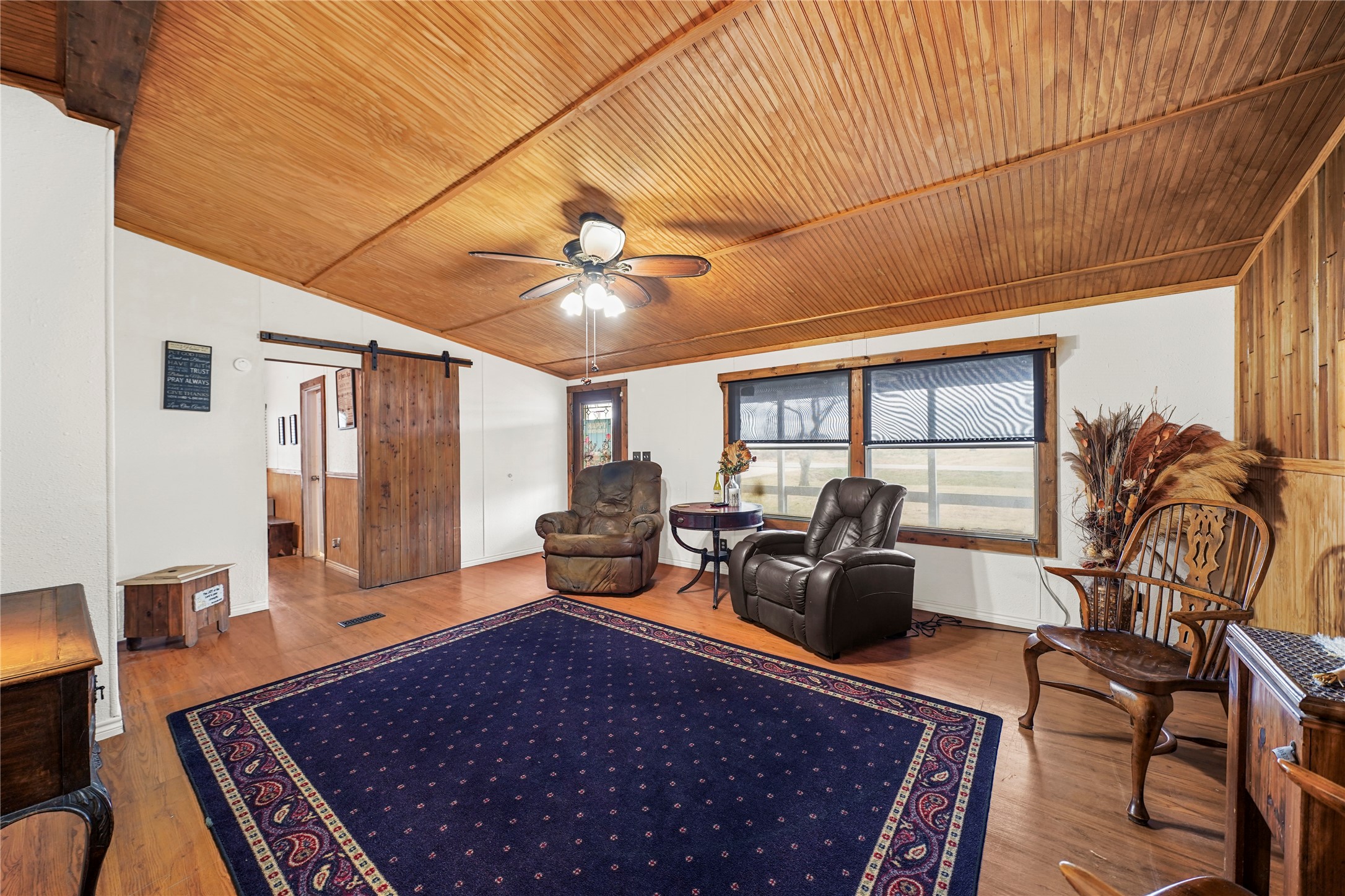 19645 Nordt Road Damon, TX 77430 - Photo 7 of 50 a living room with furniture rug and wooden floor