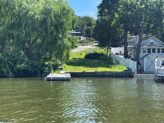 a view of a swimming pool with a yard