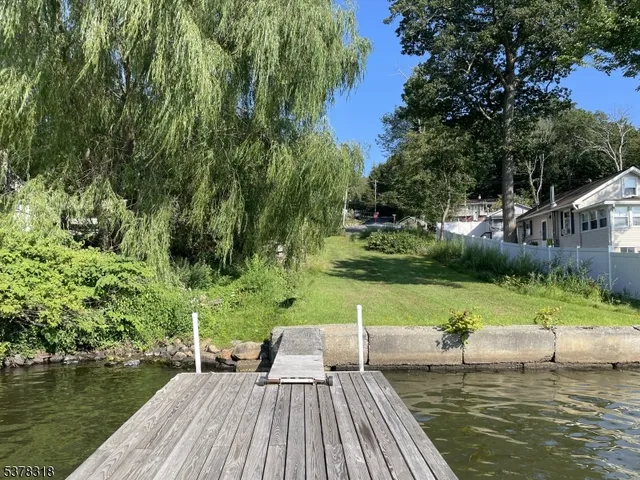 a view of a lake with a yard