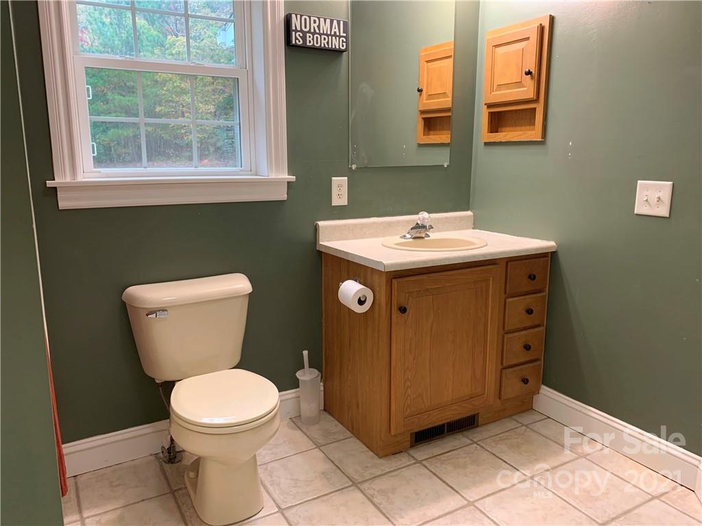 2182 Colvin Road Chester, SC 29706 - Photo 22 of 30 a bathroom with a toilet sink and mirror