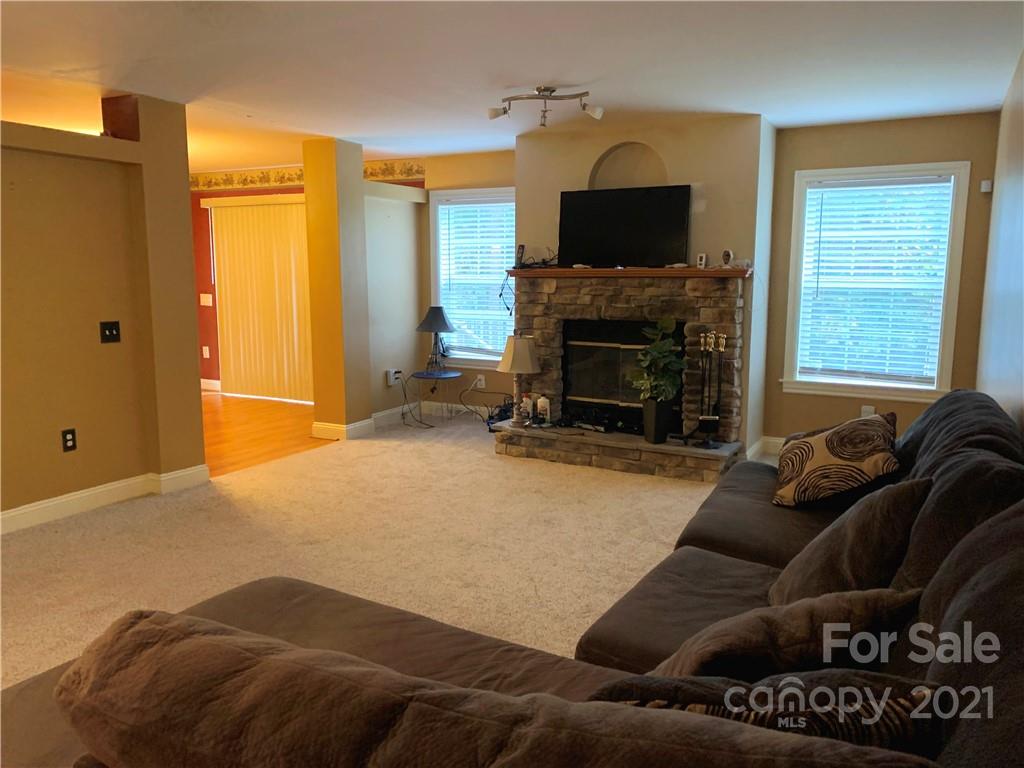 2182 Colvin Road Chester, SC 29706 - Photo 4 of 30 a living room with furniture a fireplace and a flat screen tv