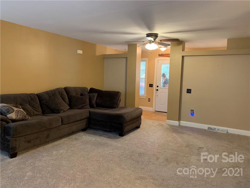 2182 Colvin Road Chester, SC 29706 - Photo 5 of 30 a living room with furniture and a chandelier