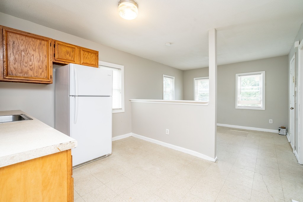16 Collins Street Springfield, MA 01109 - Photo 3 of 17 a view of kitchen with furniture and refrigerator