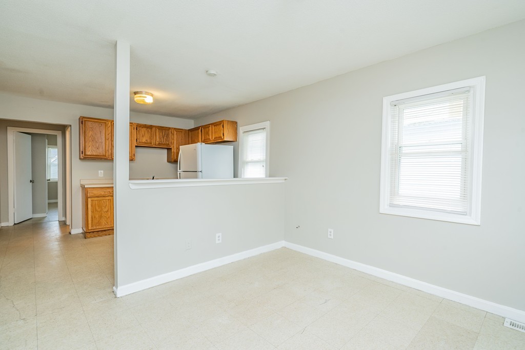 16 Collins Street Springfield, MA 01109 - Photo 5 of 17 an empty room with a cabinet and mirrors