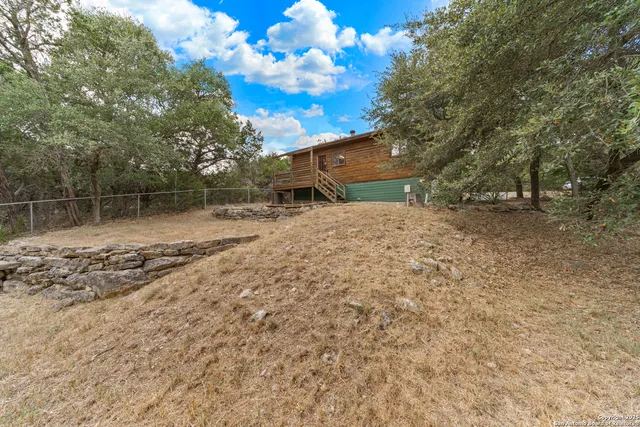 a backyard of a house with lots of green space