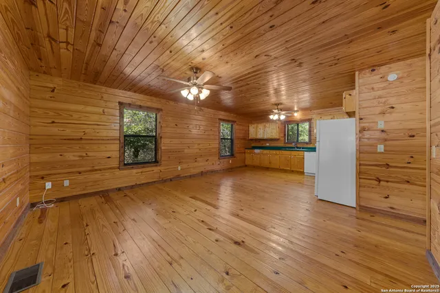a view of a livingroom with wooden floor