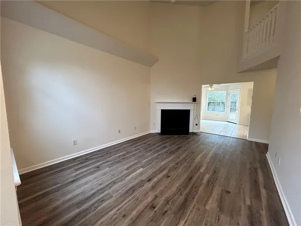 a kitchen with stainless steel appliances a refrigerator sink stove microwave and cabinets