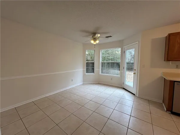a kitchen with a sink a stove and a microwave