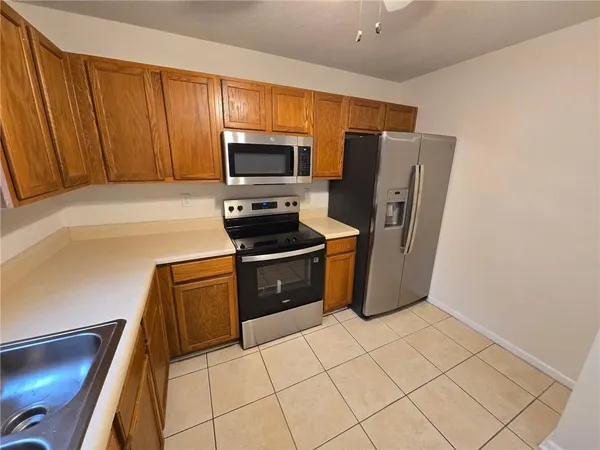 a view of a electric appliances and living room