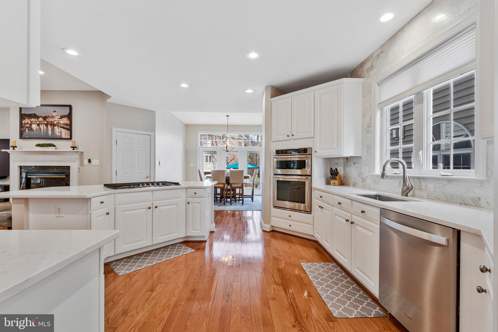 9183 Topaz Street Fairfax, VA 22031 - Photo 13 of 67 a large kitchen with cabinets