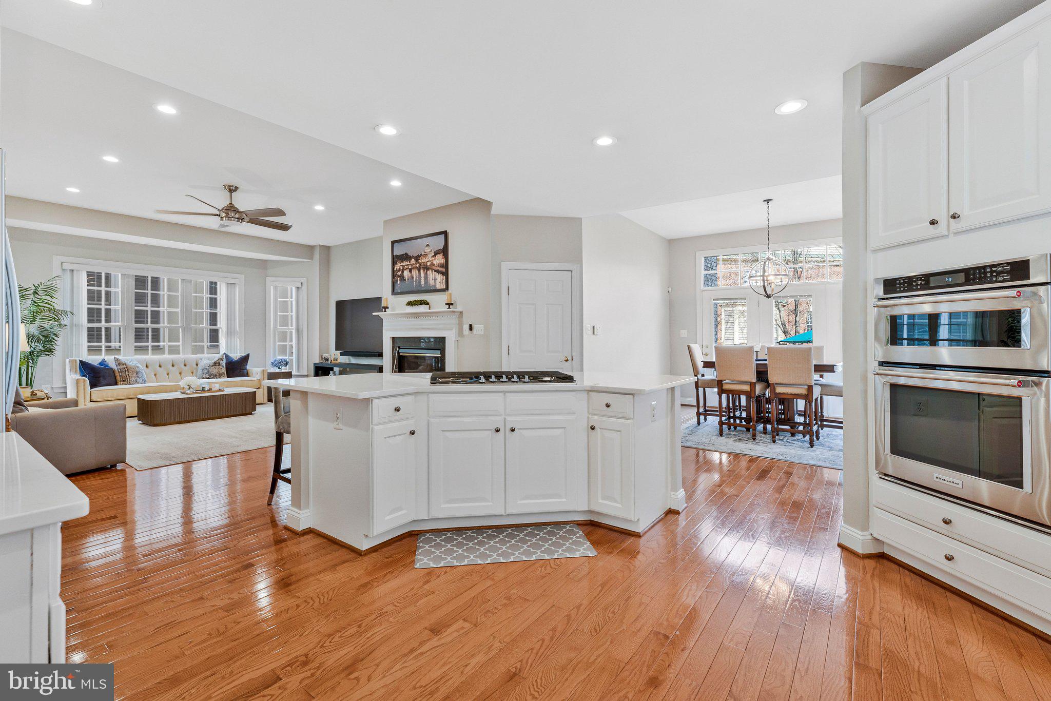 9183 Topaz Street Fairfax, VA 22031 - Photo 14 of 67 a open kitchen with white cabinets and stainless steel appliances