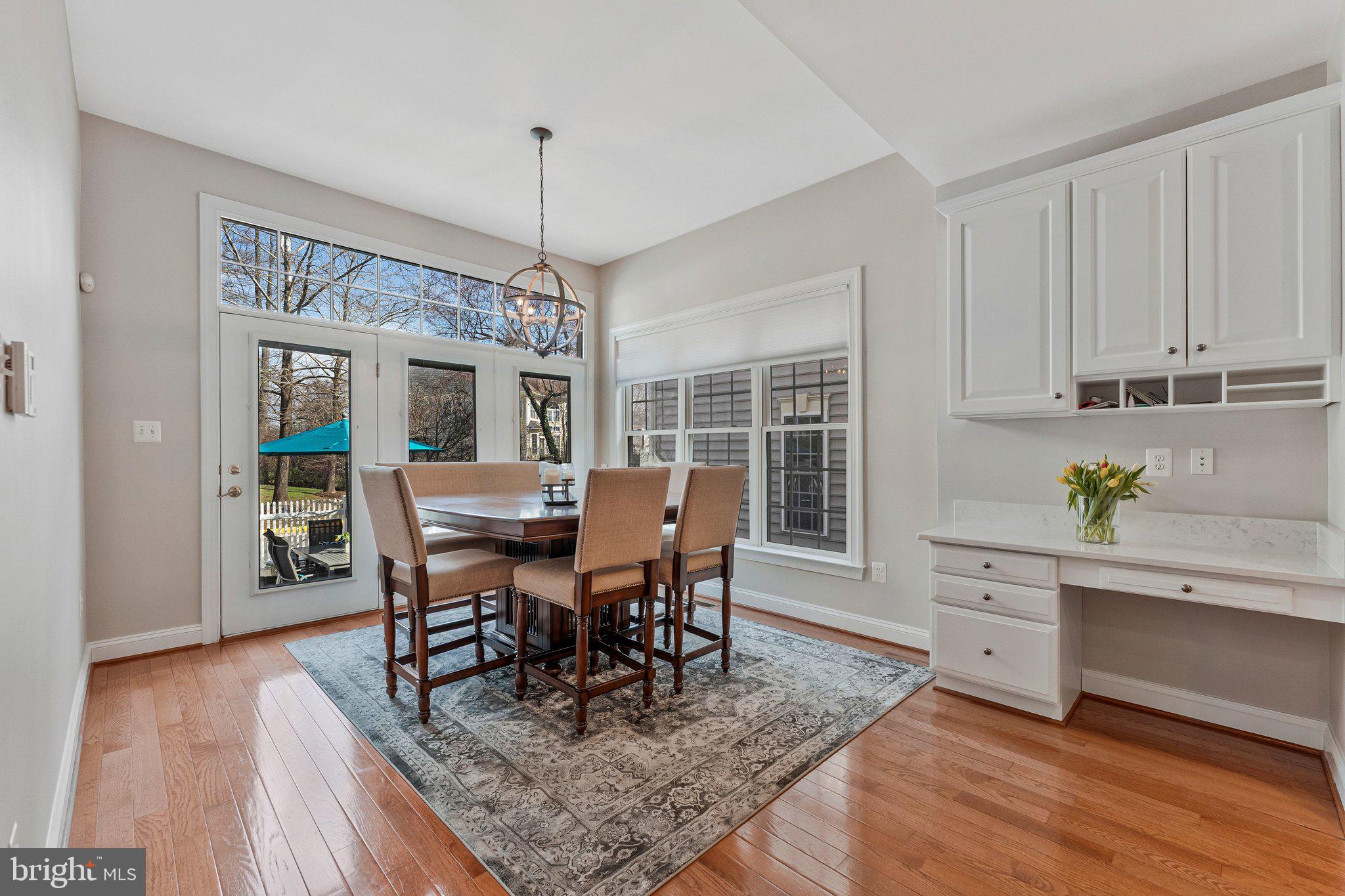 9183 Topaz Street Fairfax, VA 22031 - Photo 23 of 67 a view of a dining room with furniture window and wooden floor