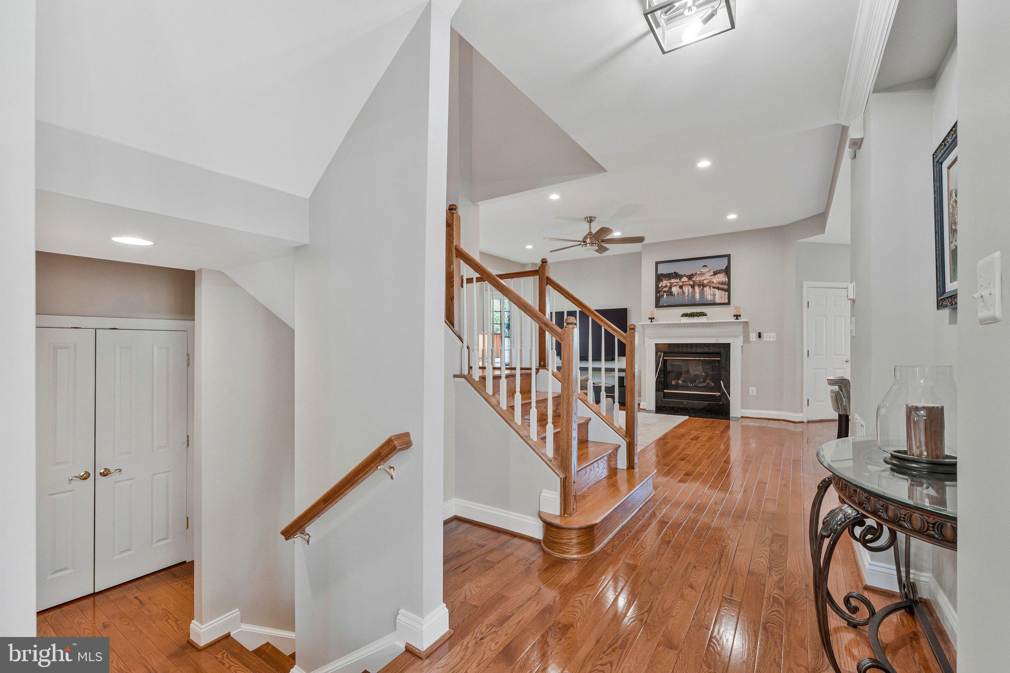 9183 Topaz Street Fairfax, VA 22031 - Photo 25 of 67 a view of a livingroom with wooden floor and staircase