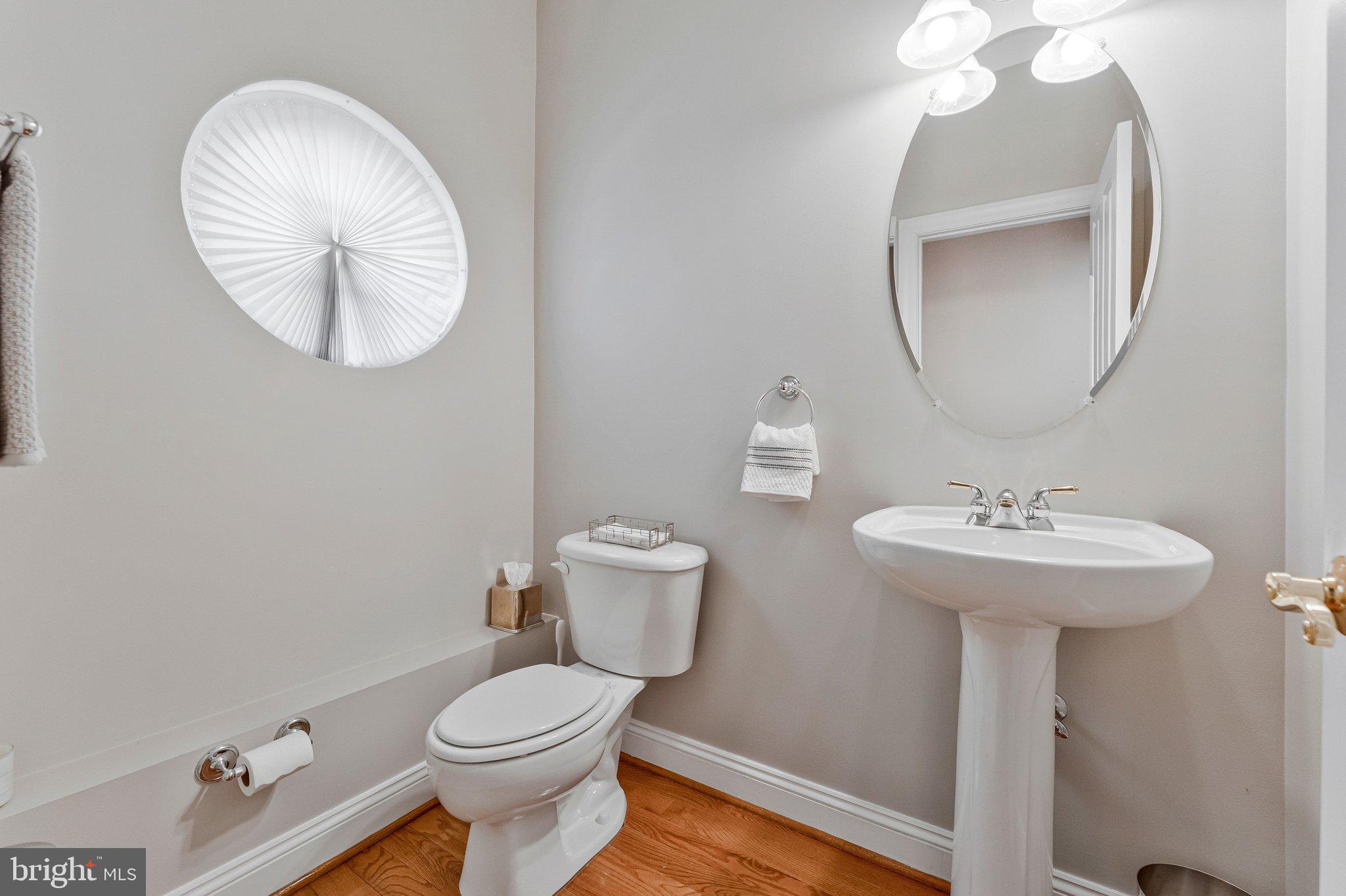 9183 Topaz Street Fairfax, VA 22031 - Photo 26 of 67 a bathroom with a sink a mirror and toilet