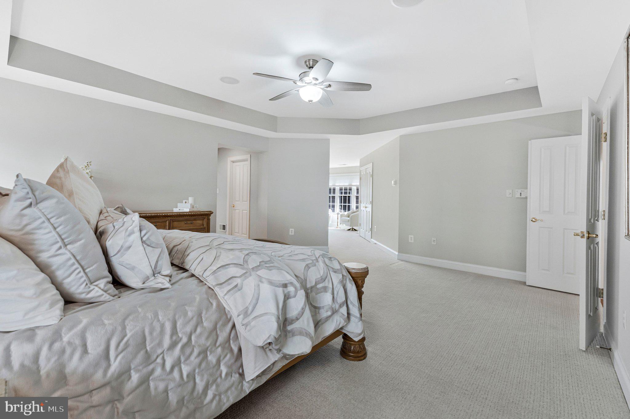 9183 Topaz Street Fairfax, VA 22031 - Photo 30 of 67 a bedroom with a bed and a chandelier