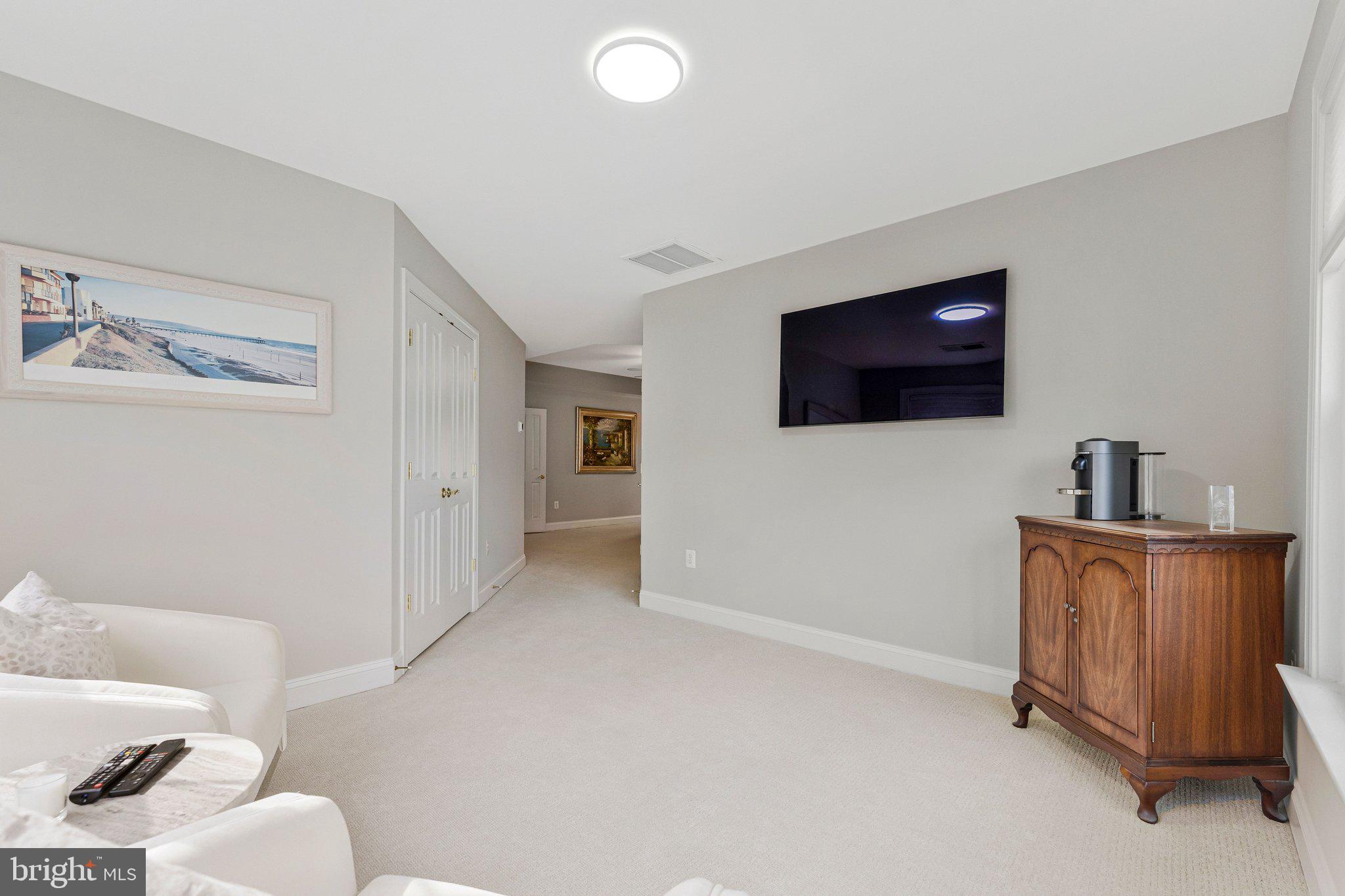9183 Topaz Street Fairfax, VA 22031 - Photo 37 of 67 a living room with furniture and a flat screen tv