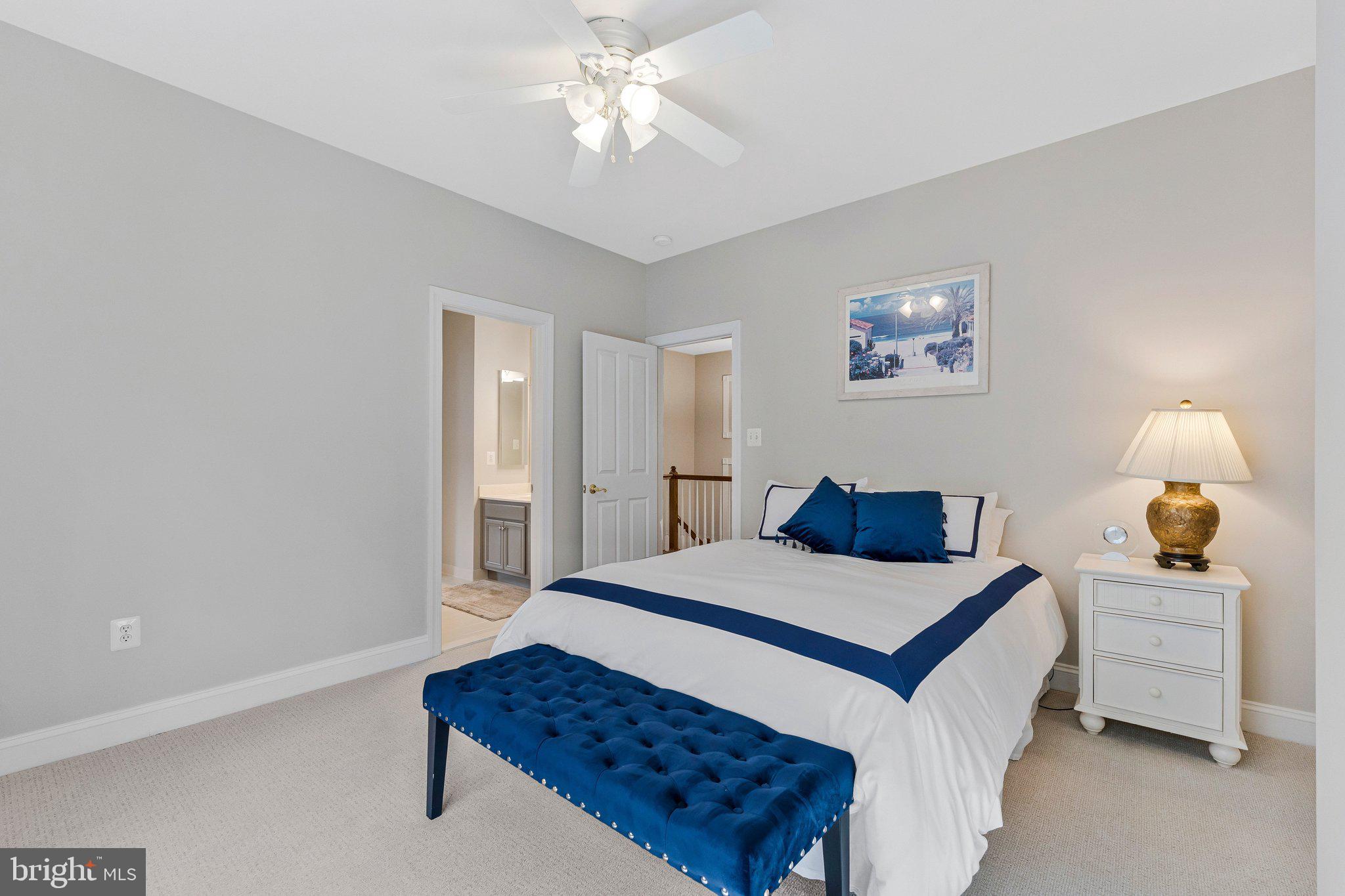 9183 Topaz Street Fairfax, VA 22031 - Photo 40 of 67 a bedroom with a bed and a chandelier
