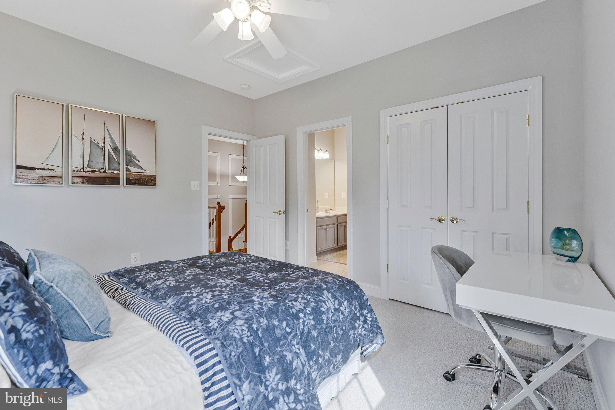 9183 Topaz Street Fairfax, VA 22031 - Photo 44 of 67 a bedroom with a bed and a chandelier