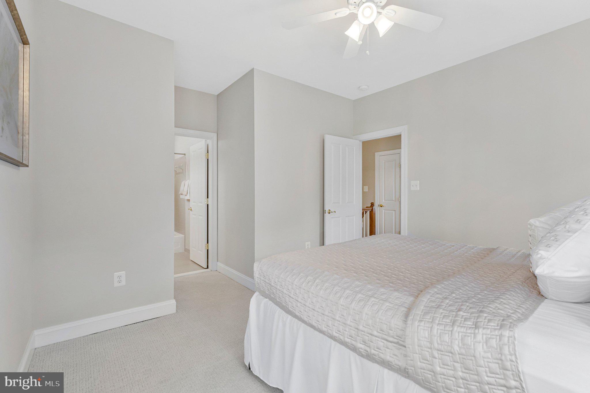 9183 Topaz Street Fairfax, VA 22031 - Photo 46 of 67 a bedroom with a bed and a chandelier
