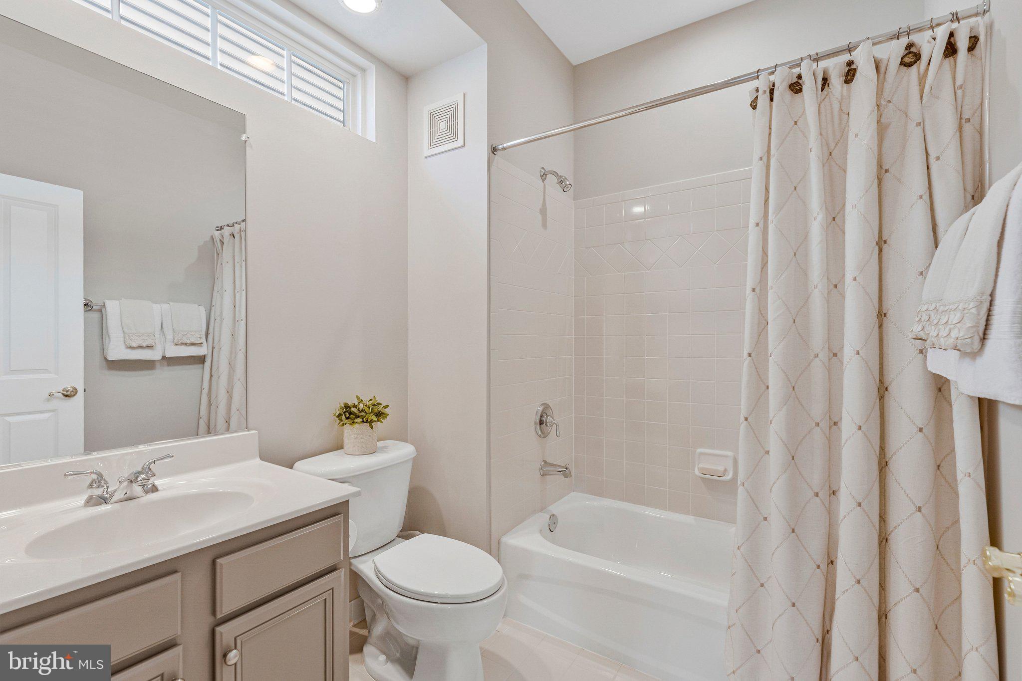 9183 Topaz Street Fairfax, VA 22031 - Photo 47 of 67 a bathroom with a sink toilet and shower