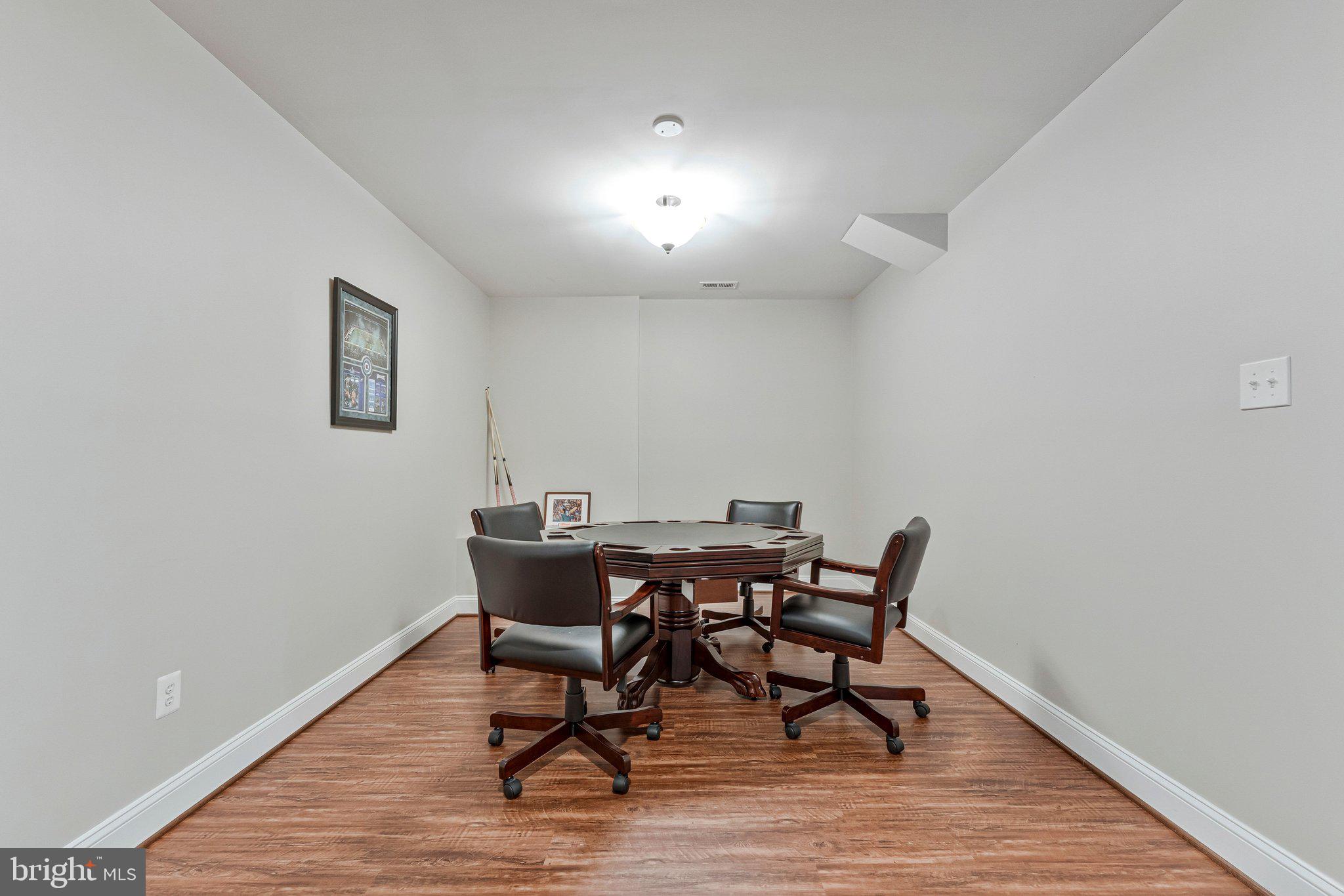 9183 Topaz Street Fairfax, VA 22031 - Photo 54 of 67 a view of a dining room with furniture and wooden floor