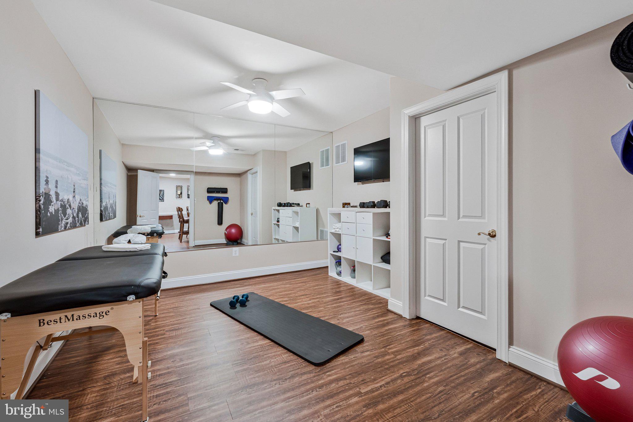 9183 Topaz Street Fairfax, VA 22031 - Photo 55 of 67 a living room with furniture and a wooden floor