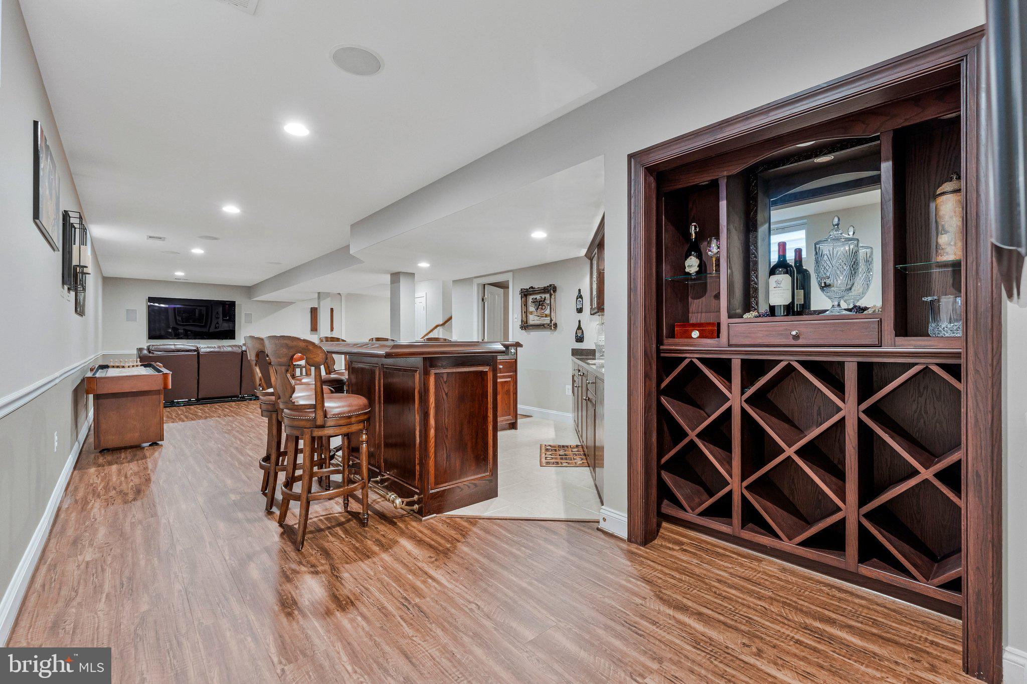 9183 Topaz Street Fairfax, VA 22031 - Photo 56 of 67 a view of a dining room with furniture and wooden floor