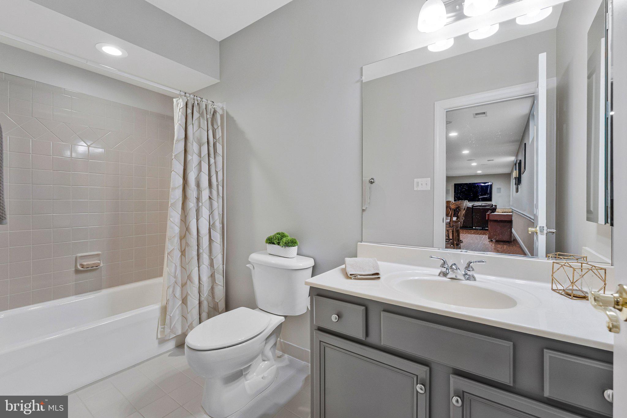 9183 Topaz Street Fairfax, VA 22031 - Photo 57 of 67 a bathroom with a sink toilet tub and shower