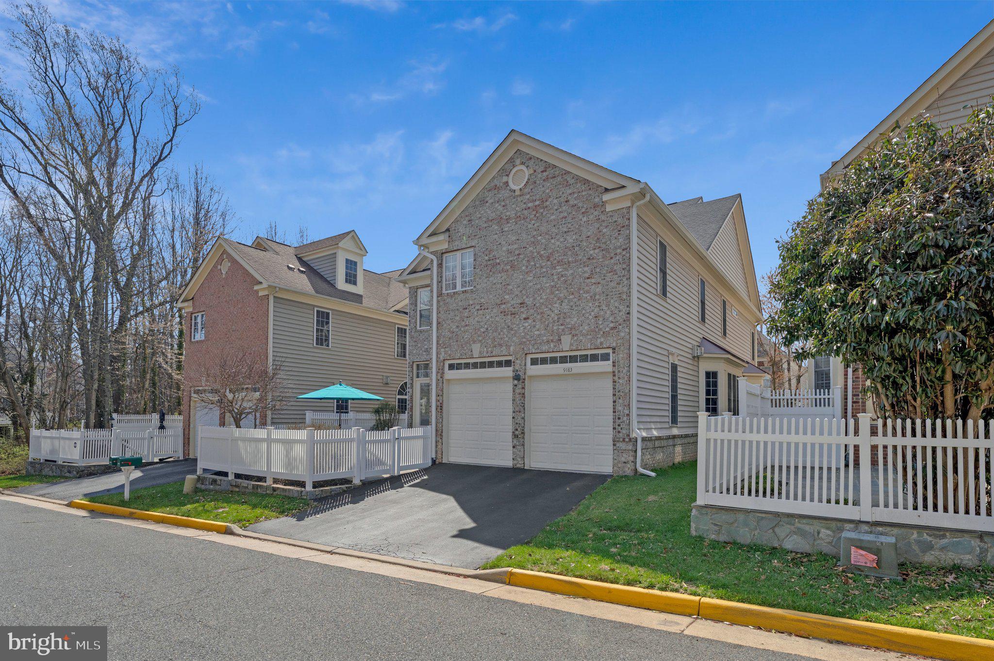 9183 Topaz Street Fairfax, VA 22031 - Photo 61 of 67 a view of a house with a yard and sitting area