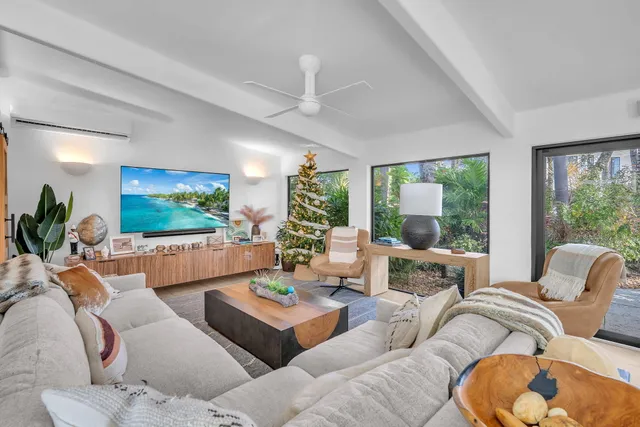 a kitchen with stainless steel appliances granite countertop a sink and a large window
