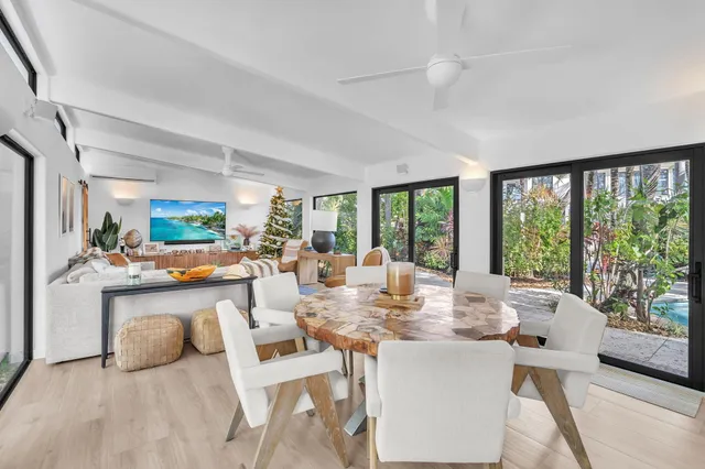 a white toilet sitting next to a shower curtain