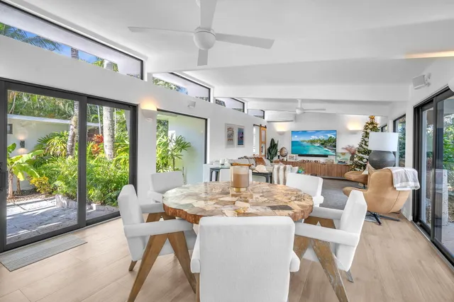a bathroom with a granite countertop sink a vanity and a bathtub