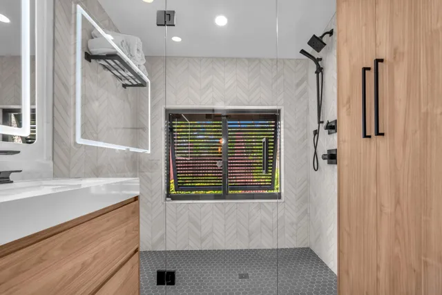 a bathroom with a shower and a sink