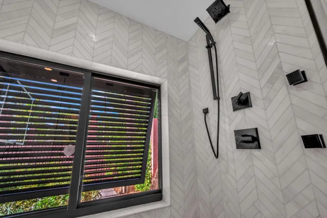 a view of a yard with plants and trees