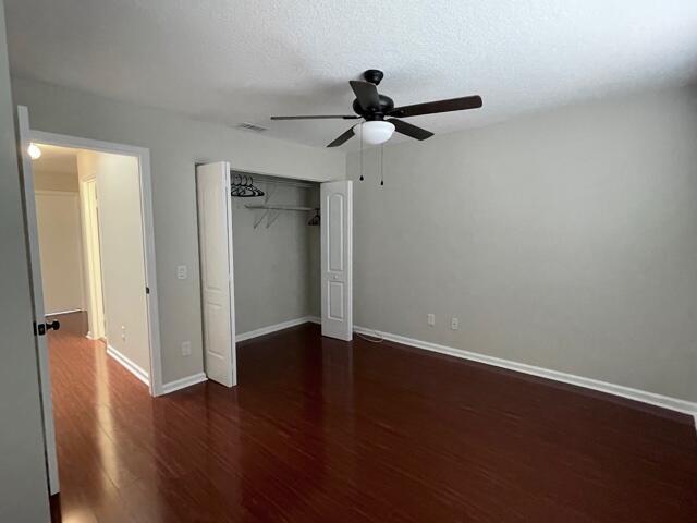 6763 Via Regina Boca Raton, FL 33433 - Photo 16 of 39 an empty room with wooden floor closet and windows