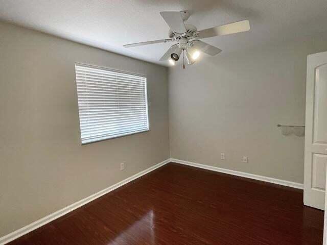 6763 Via Regina Boca Raton, FL 33433 - Photo 18 of 39 a view of a room with wooden floor and windows
