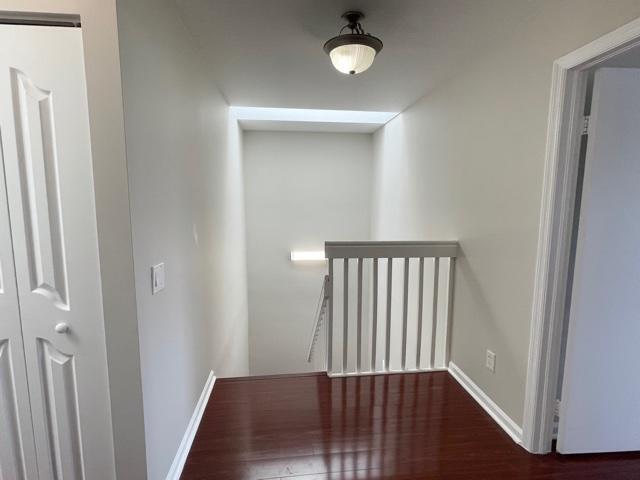 6763 Via Regina Boca Raton, FL 33433 - Photo 25 of 39 a view of a hallway with wooden floor and staircase