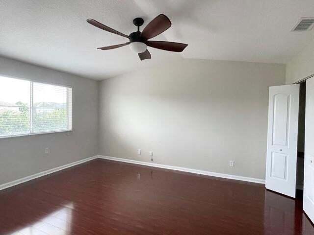 6763 Via Regina Boca Raton, FL 33433 - Photo 28 of 39 an empty room with wooden floor fan and windows