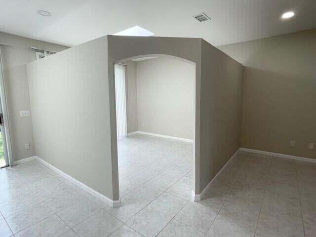 6763 Via Regina Boca Raton, FL 33433 - Photo 34 of 39 an empty room with closet and a bathroom