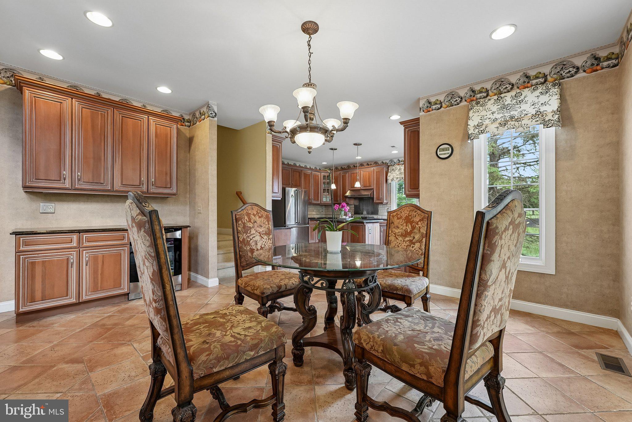 1 Baker Way Pennington, NJ 08534 - Photo 20 of 77 a view of a dining room with furniture and a chandelier