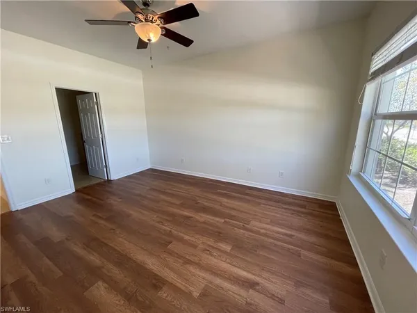 a bathroom with a double vanity sink a mirror and a bathtub