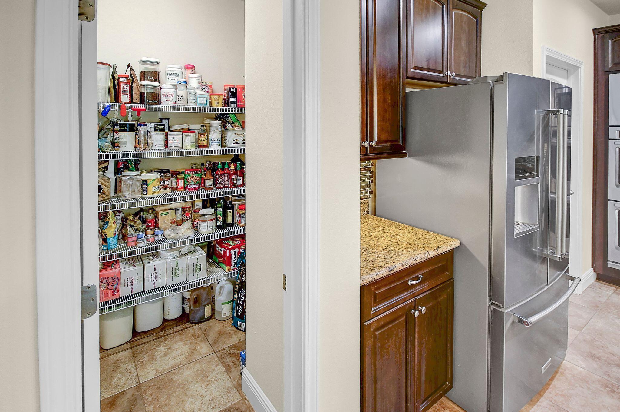 28 Haven Way Freeport, FL 32439 - Photo 17 of 50 a kitchen with refrigerator and wooden floor