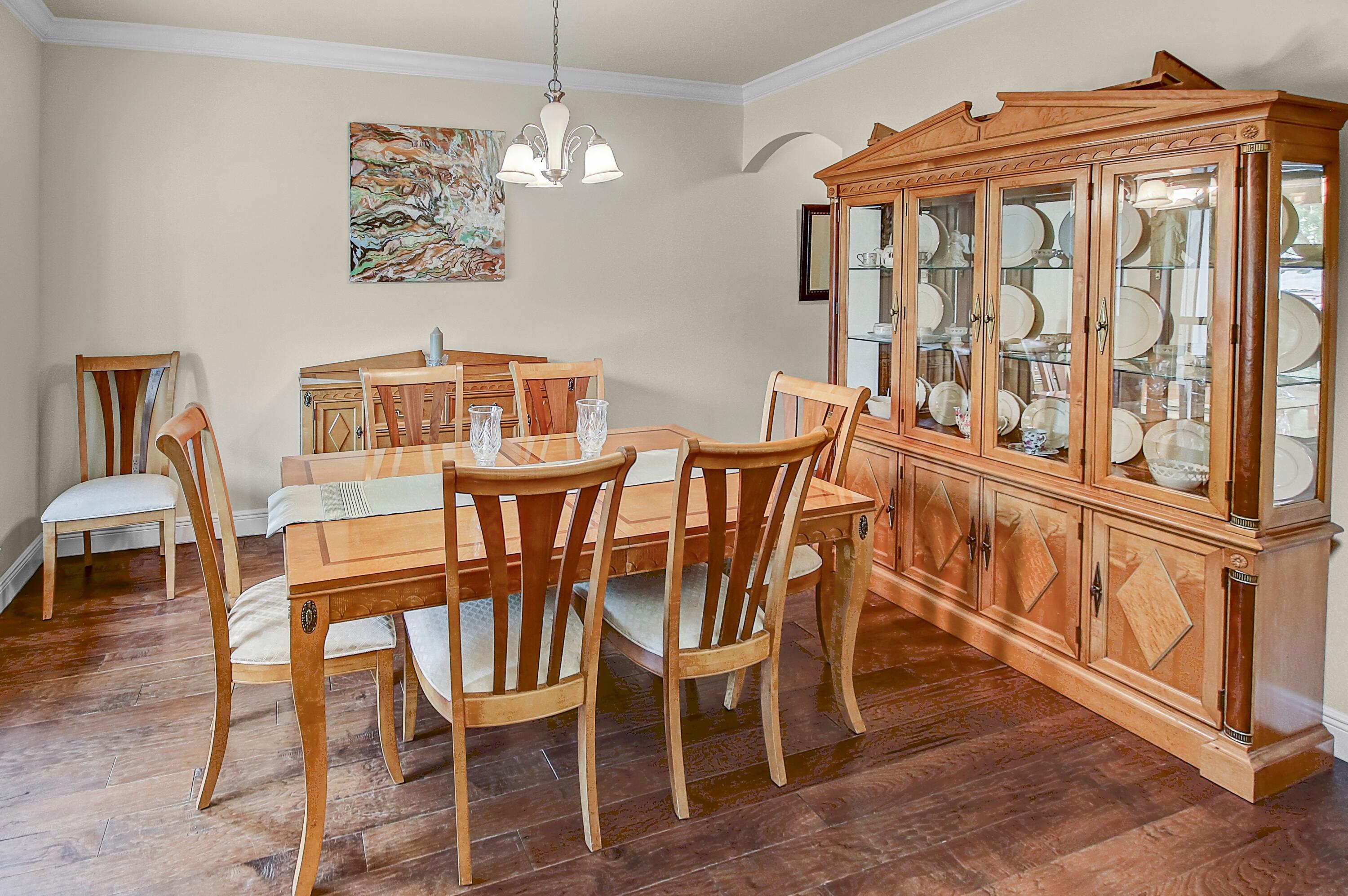 28 Haven Way Freeport, FL 32439 - Photo 19 of 50 a view of a dining room with furniture wooden floor and a chandelier