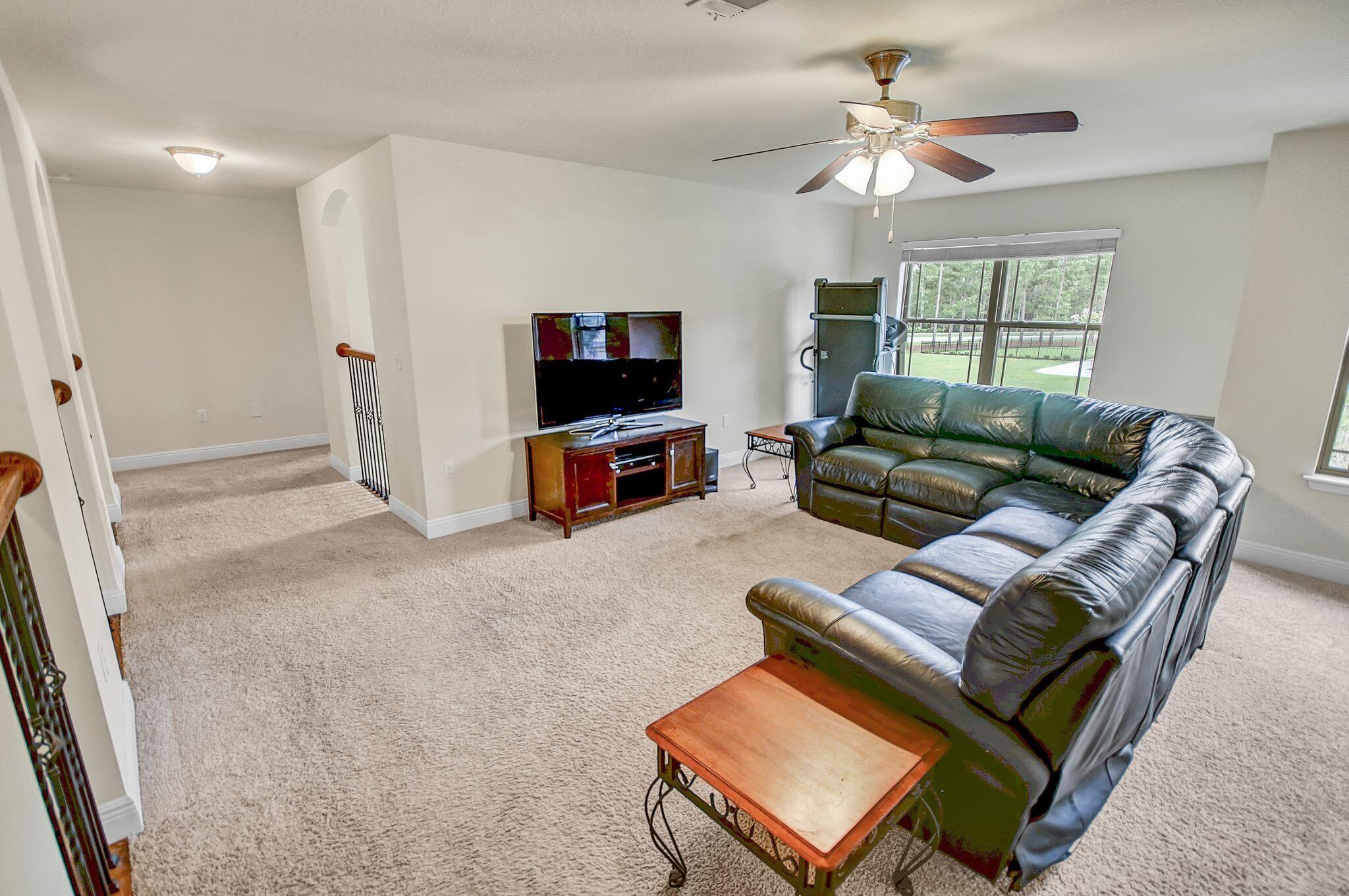 28 Haven Way Freeport, FL 32439 - Photo 23 of 50 a living room with furniture and a flat screen tv