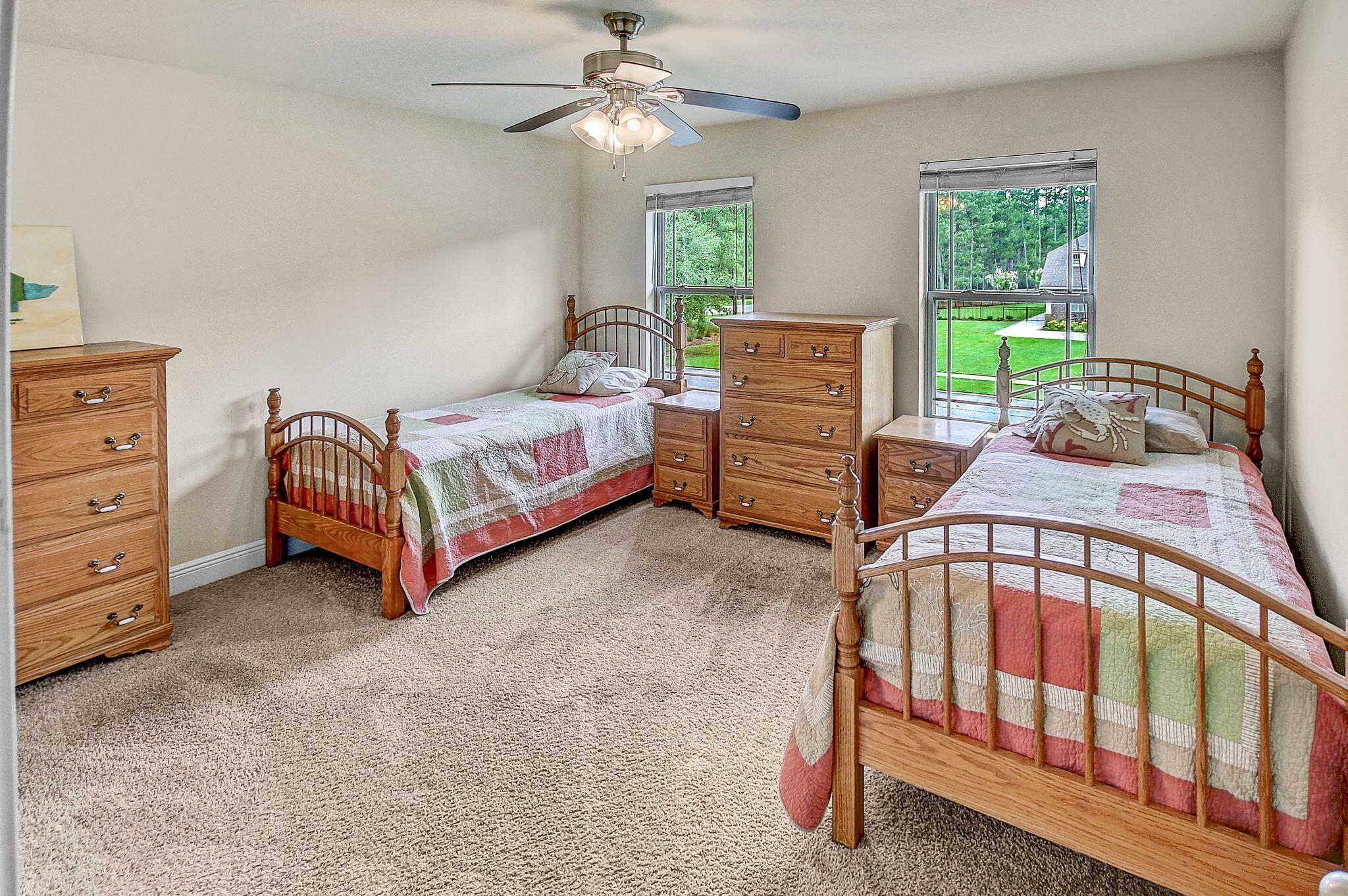 28 Haven Way Freeport, FL 32439 - Photo 27 of 50 a bedroom with a bed and a baby crib