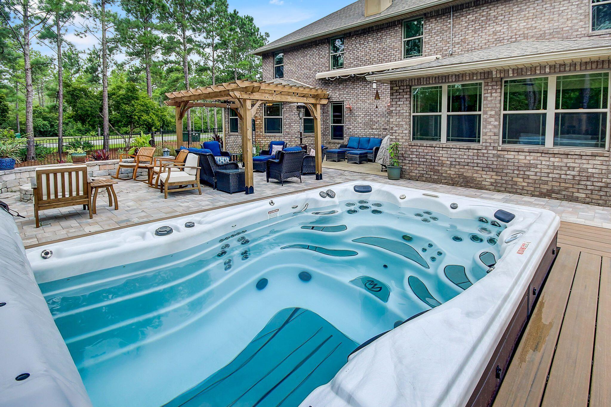 28 Haven Way Freeport, FL 32439 - Photo 3 of 50 a view of a patio with table and chairs potted plants with wooden floor