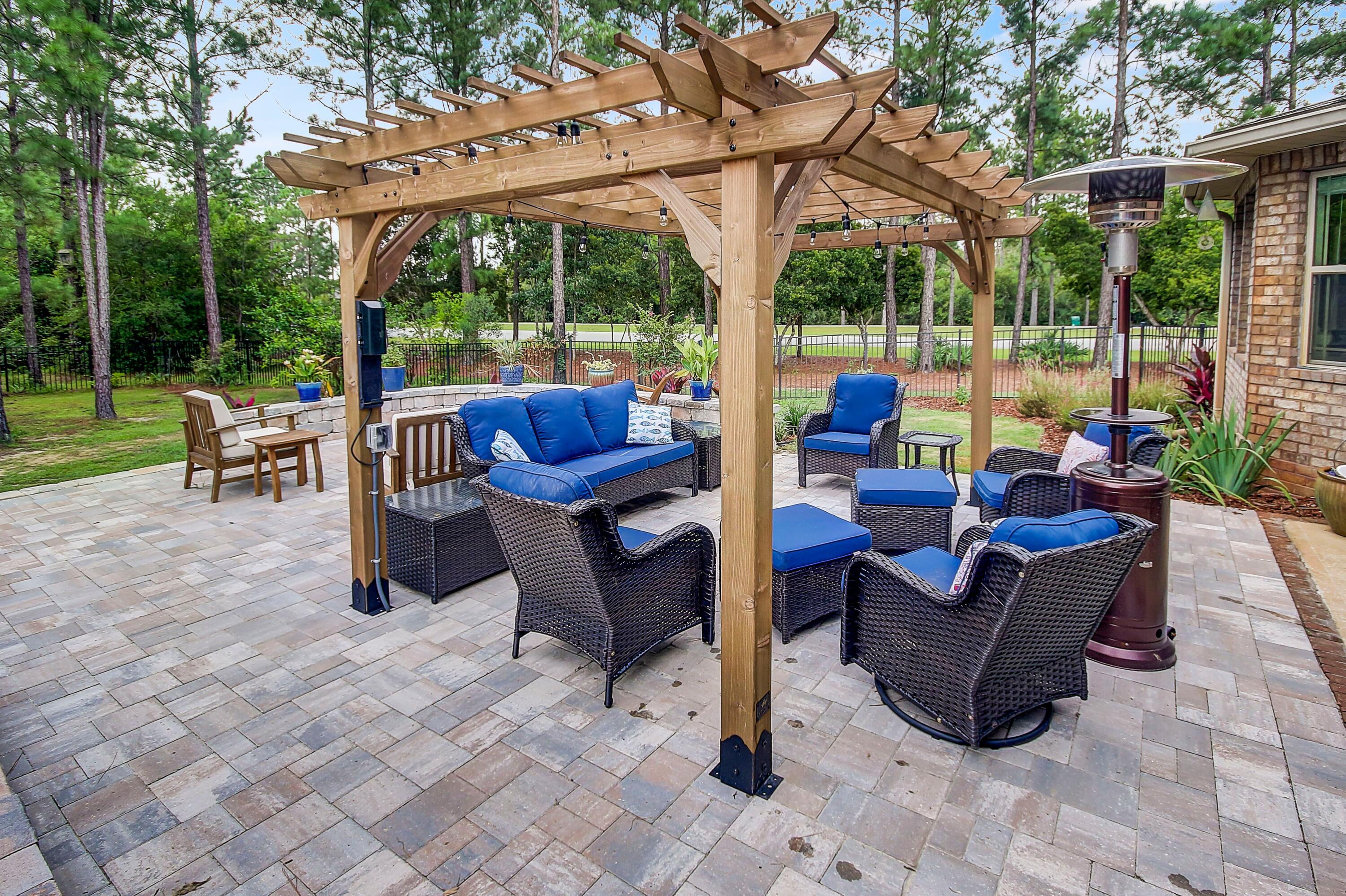 28 Haven Way Freeport, FL 32439 - Photo 35 of 50 a view of a patio with a table chairs and a backyard