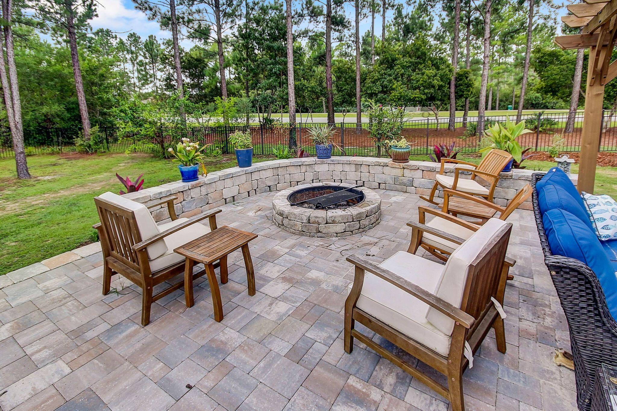 28 Haven Way Freeport, FL 32439 - Photo 36 of 50 a view of a patio with couches chairs and a yard
